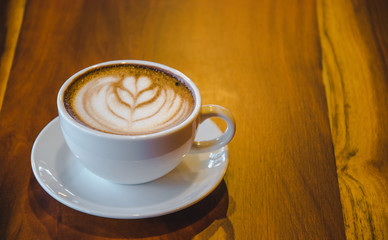 a cup of hot coffee (selective focus for mood and tone)