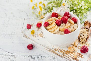 Tasty and healthy oatmeal porridge. Summer breakfast. Copy space