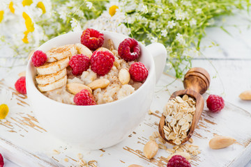 Tasty and healthy oatmeal porridge. Summer breakfast. Copy space