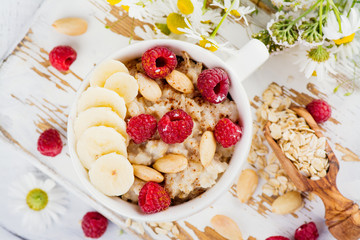 Tasty and healthy oatmeal porridge. Summer breakfast. Copy space