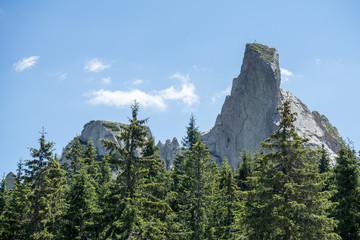Obraz premium View of Pietrele Doamnei montain (Lady's stones cliff) from the valley. Rarau mountains in Bucovina, Romania