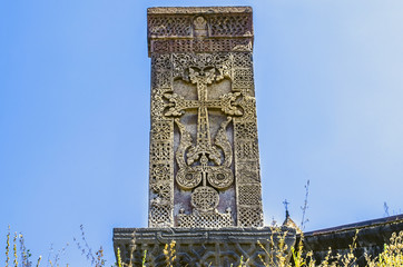 Medieval engraved stone cross with a cover on the territory of the monastery of Haghpat


