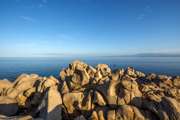 View on Corsica from Capo Testa, Sardinia, Italy