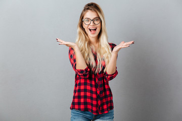 Emotional surprised young blonde woman