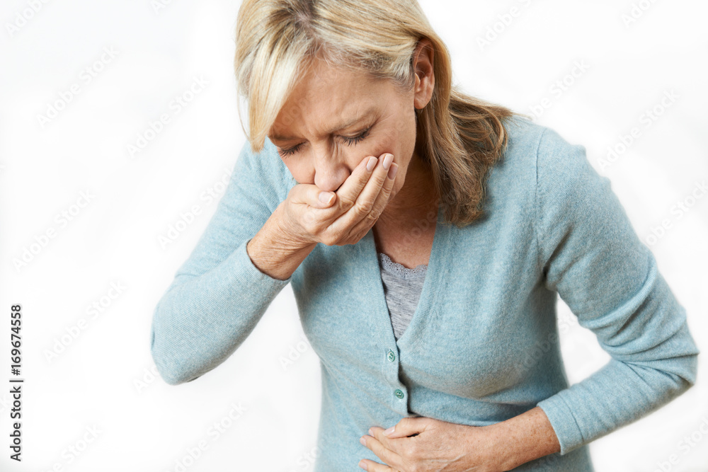 Wall mural Studio Shot Of Mature Woman Suffering From Nausea