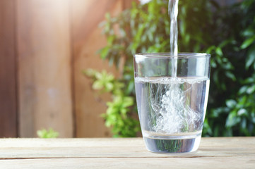 drinking water on wood background