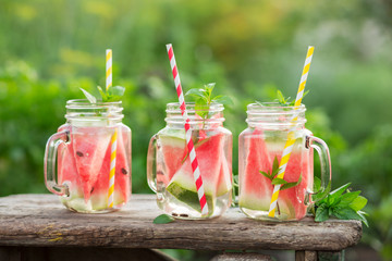 Fototapeta na wymiar Watermelon water in glass jars
