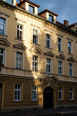 Fototapeta na wymiar Evening sunlight on the facade of building in Ljubljana.