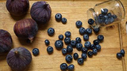 Fototapeta na wymiar Fig and blueberry on wood. Dessert. Fruit and berries.