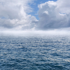 Blue sky with clouds over the sea.