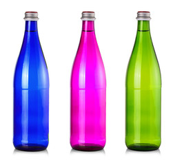 Set of colored bottles of water mineral isolated on white background.