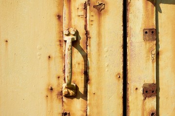 Old weathered paint on iron gate