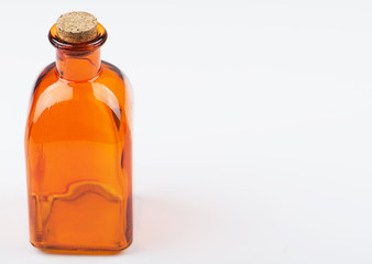 Glass jar of orange color on white background. Isolated. Container. Copy space.