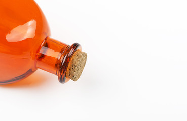 Close-up of lilac glass jar with cork stopper on white background. Isolated. Container.