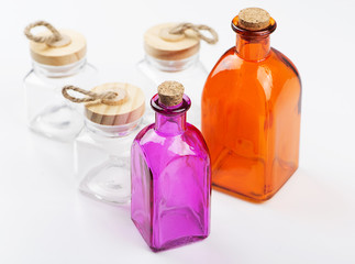 Various white and colored glass votes on white background. Isolated. Container.