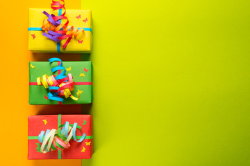 Fototapeta na wymiar Gift boxes on colorful background