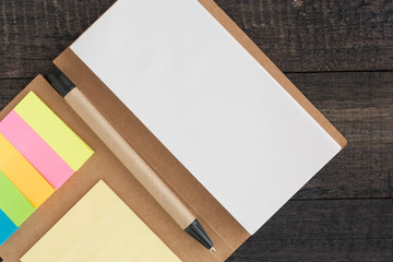 Notebook, Notepaper, on wood background, selective focus.
