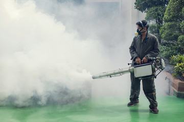 Naklejka premium Man work fogging to eliminate mosquito for preventing spread dengue fever and zika virus