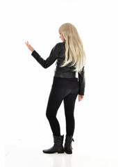 full length portrait of blonde girl wearing black leather outfit, standing pose on white background.