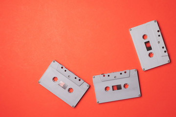 Audio cassette tapes on a orange background. Free space for text