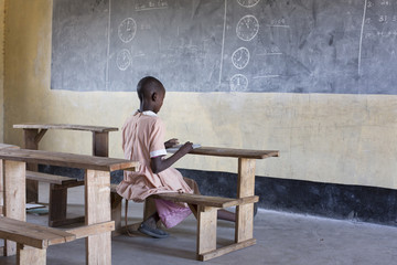 School girl studying in the classroom
