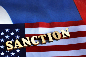 usa flag sanctions wooden letters on them