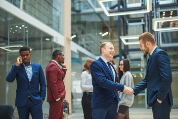 Business people shaking hands in the office after the contract is signed