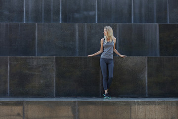 Fototapeta premium Fitness sport woman runner training outdoors, street style, urban fashion