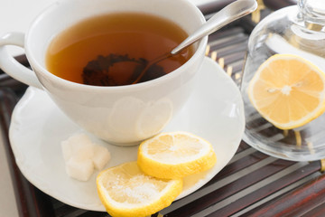 Hot tea with lemon and sugar