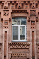 Plastic window in a vintage building. Architecture