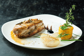Delicious duck breast on a white plate