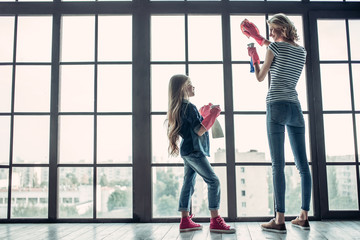 Mom with daughter doing cleaning