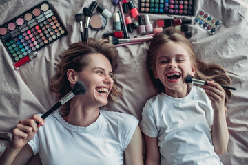 Mom with daughter doing makeup