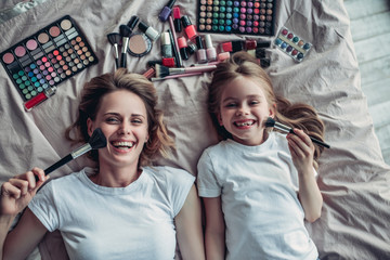 Mom with daughter doing makeup