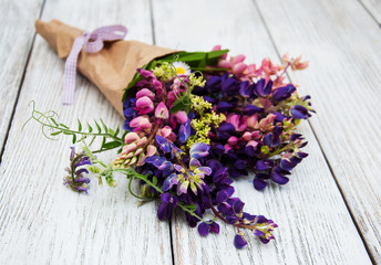 Obraz na płótnie Canvas Lupine flowers on a table