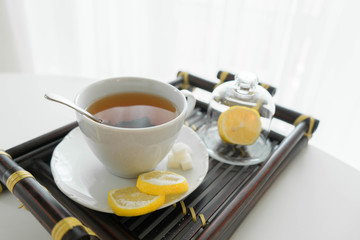 Obraz na płótnie Canvas hot tea with lemon and sugar
