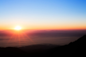 sun rise over a fog and mountain  in Thailand