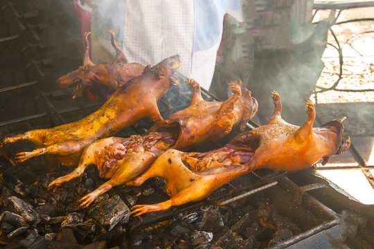 Cuy a la brasa.  Ecuador. Grilled guinea pig on charcoal. Fried Kui. National food of Ecuador.