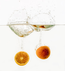 Fruits throwing into the water