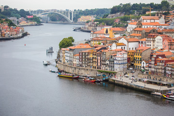 Fototapeta na wymiar Porto, Portugal - July 2017. The Douro River and the Ribeira District which is the most famous part of Porto