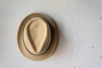 Classic hat on white wall