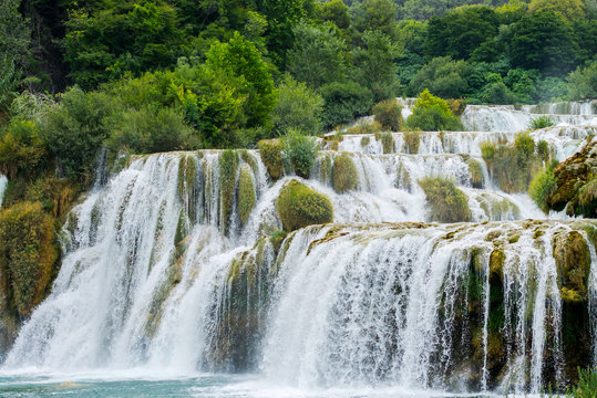 Nature landscape of waterfall cascade in the Croatia. National park Krka is popular travel placewith waterfalls in Europe. Mountain forest waterfall landscape. © Alexey Yuzhakov
