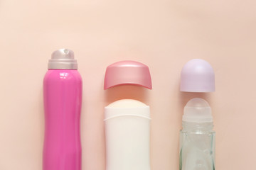 Female deodorants on light background