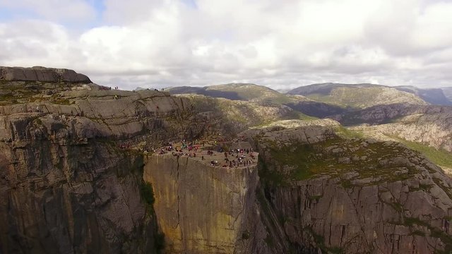 Tourists on the Pulpit Rock in Norway in summer, aerial view