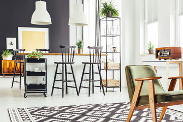 Kitchen with rustic green chair