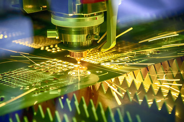 The fiber  laser cutting machine  cutting the sheet metal plate with the sparking...