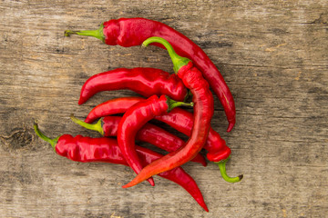 Red hot chili peppers on wooden table