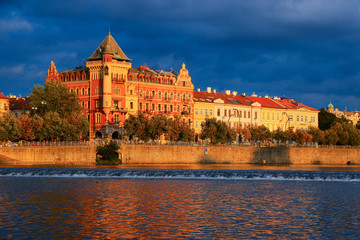 Reflections on the Vltava river at sunset in Prague city center