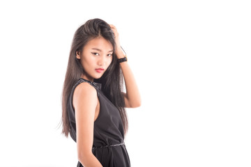 Portrait of a smiling brunette asian woman .Beautiful sexy female model posing isolated on white