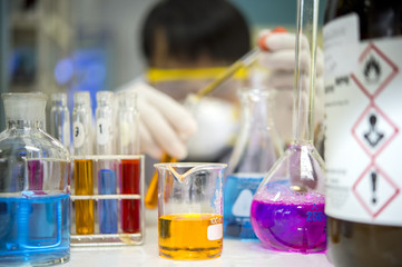 Asian scientists are experimenting with chemistry in the laboratory.